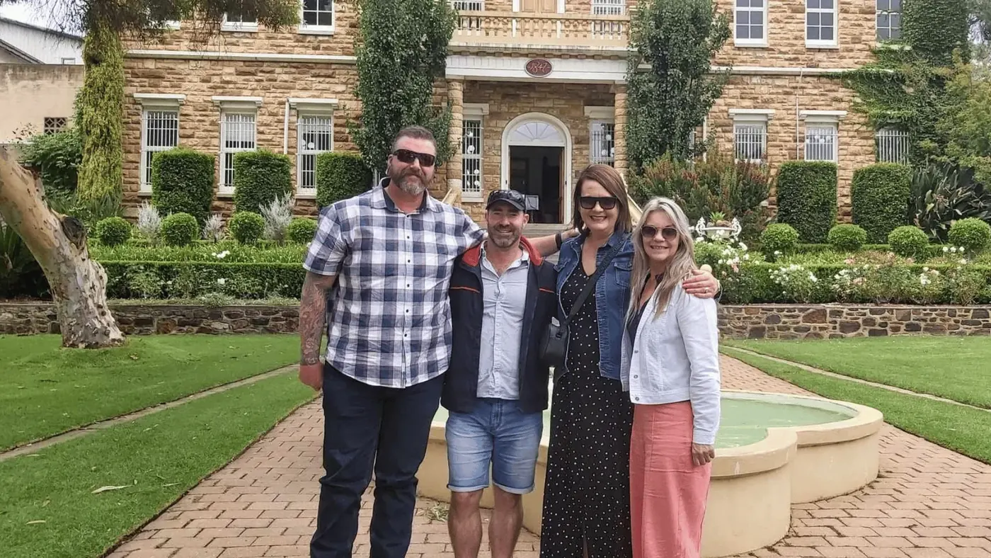 The bluestone facade and formal lawns of the historic Chateau Tanunda estate