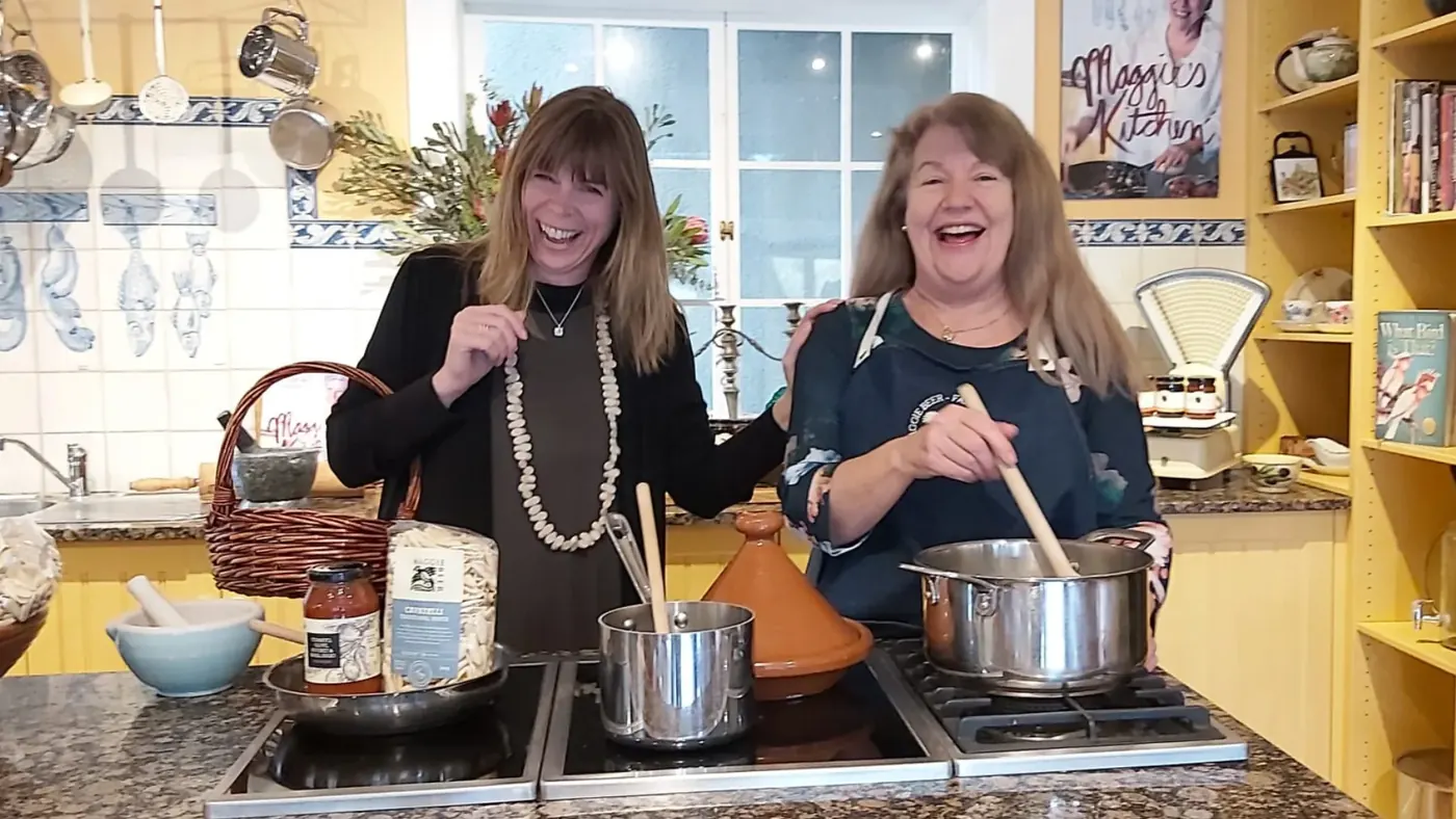 Guests taking part in a cooking demonstration at Maggie Beer's Farm Shop kitchen