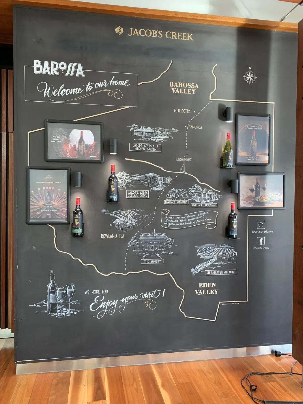 Chalkboard map of the Barossa and Eden Valley wine subregions painted on a cellar-door wall