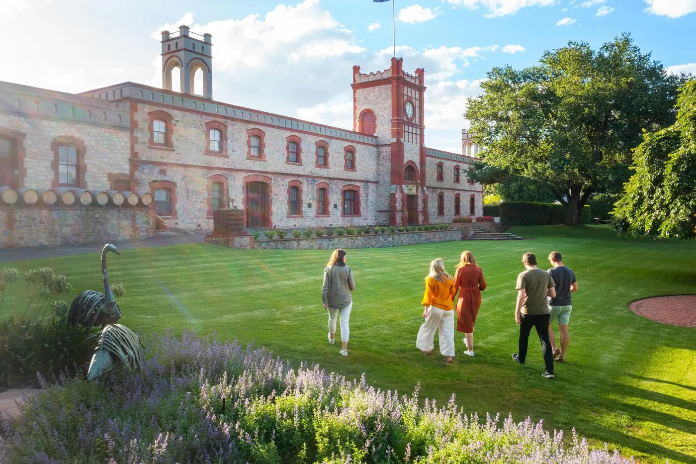 The ironstone tower and lawns of a grand nineteenth-century Barossa winery